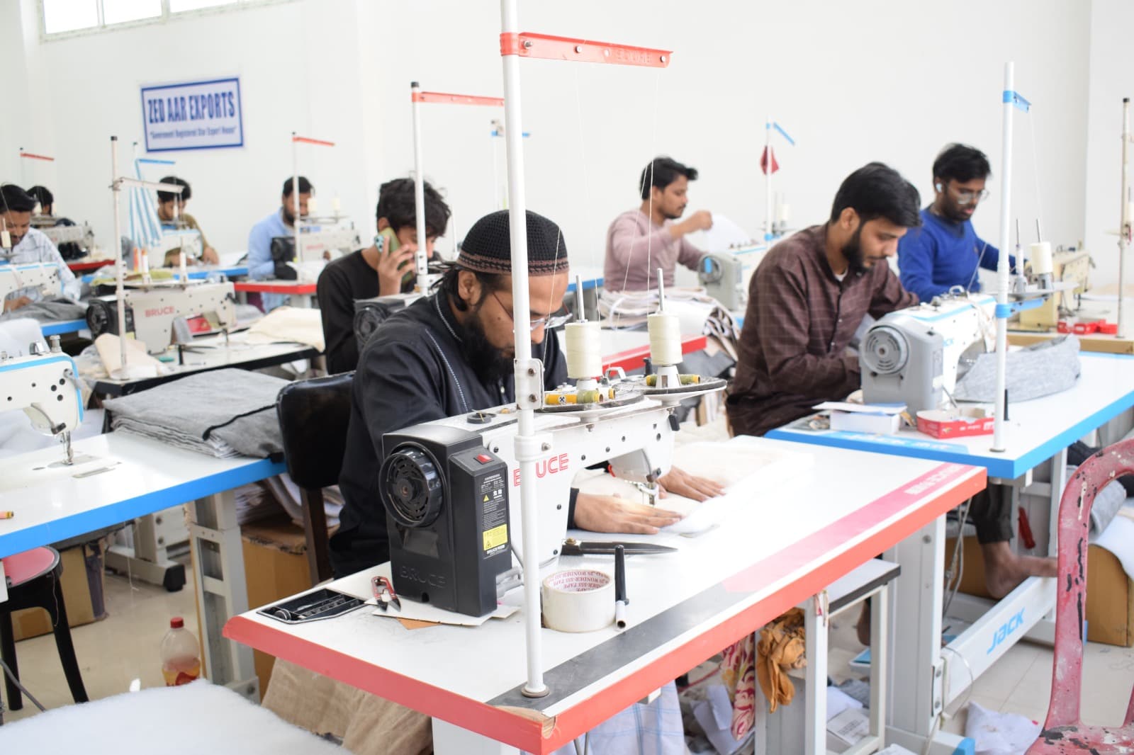 Skilled artisan operating an industrial sewing machine
