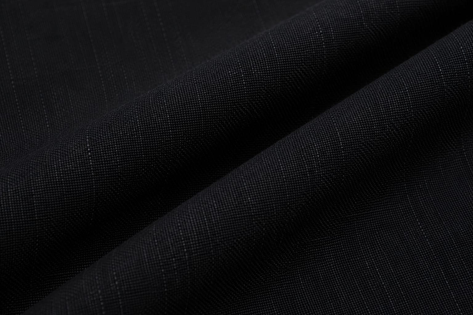 Close-up of charcoal linen fabric with a fine pinstripe