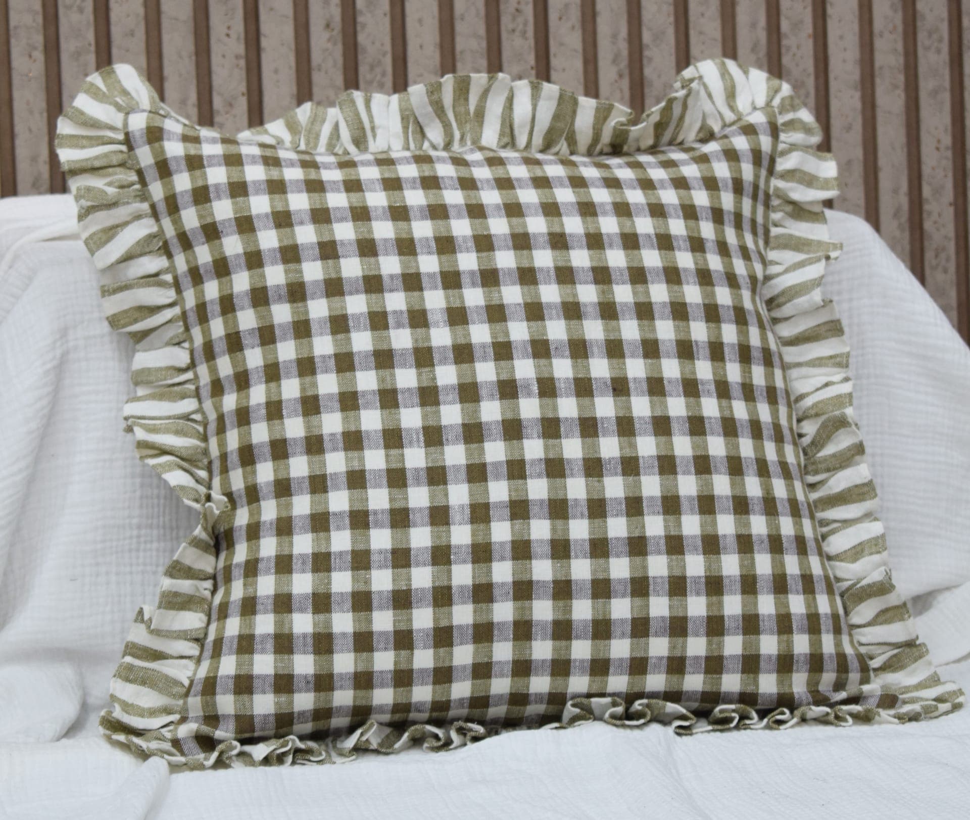 Olive gingham linen cushion with a ruffled border