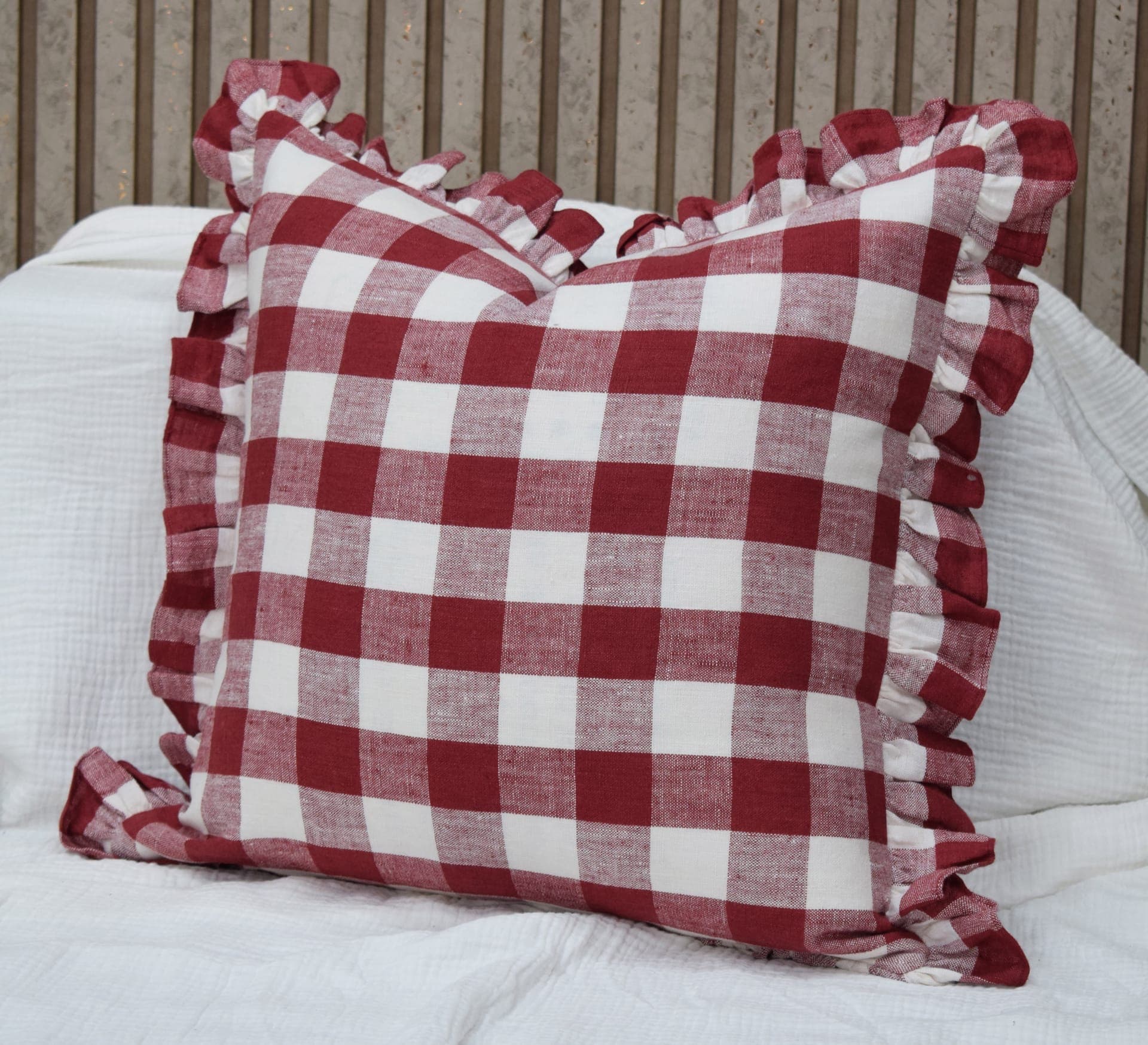 Red gingham linen cushion with ruffled edges
